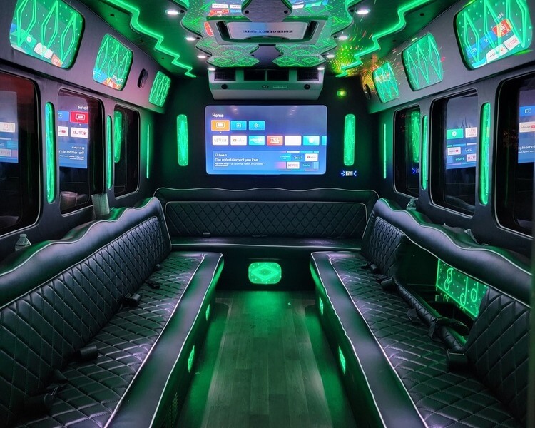 Party bus interior green lighting and entertainment screen