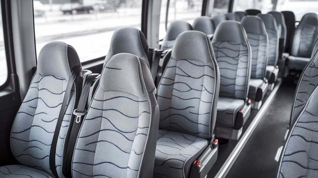 30 passenger shuttle bus interior with gray patterned passenger seats